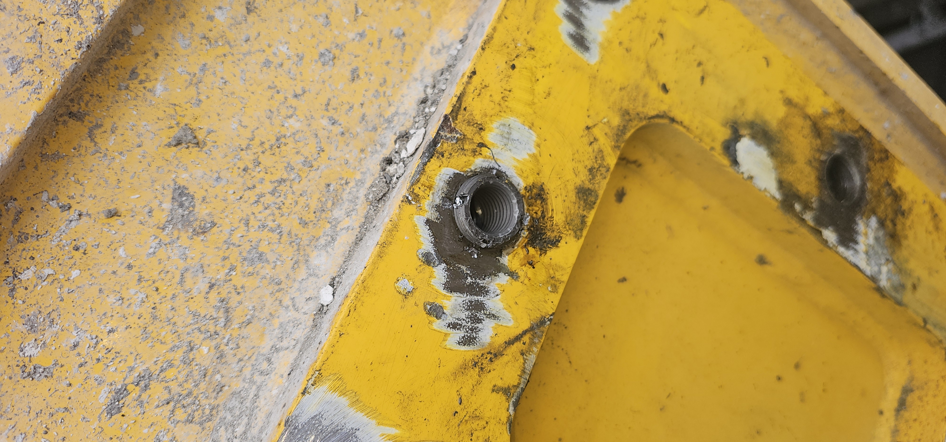 Freshly tapped oversize hole awaiting the thread insert