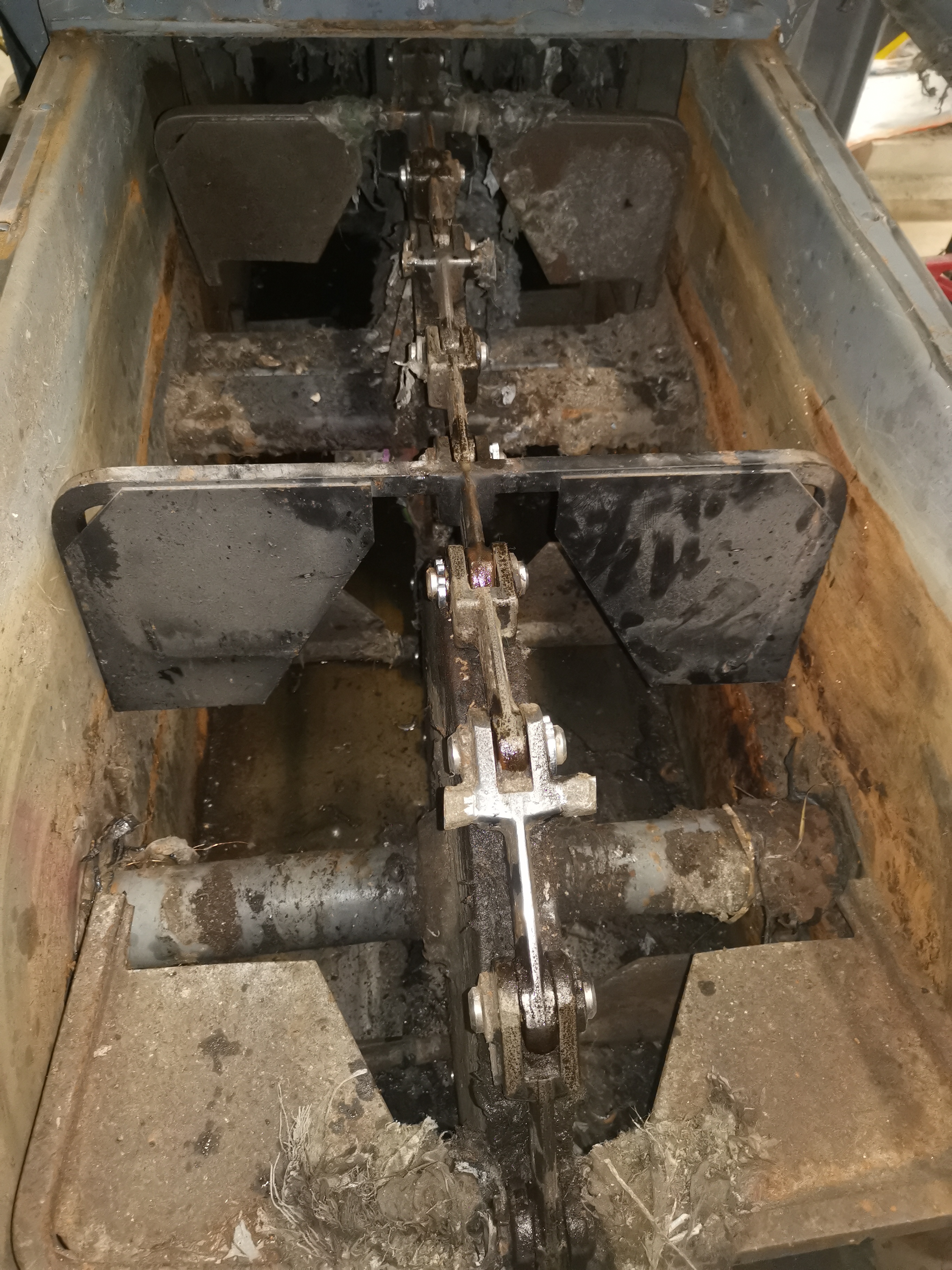 Chain elevator buckets stripped for repair after the ram failure